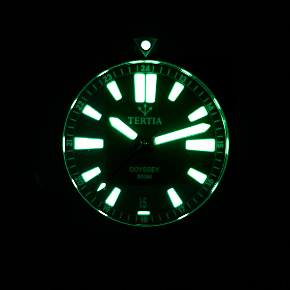 Green luminous watch dial with TERTIA and ODYSSEY 300m text, minute markers