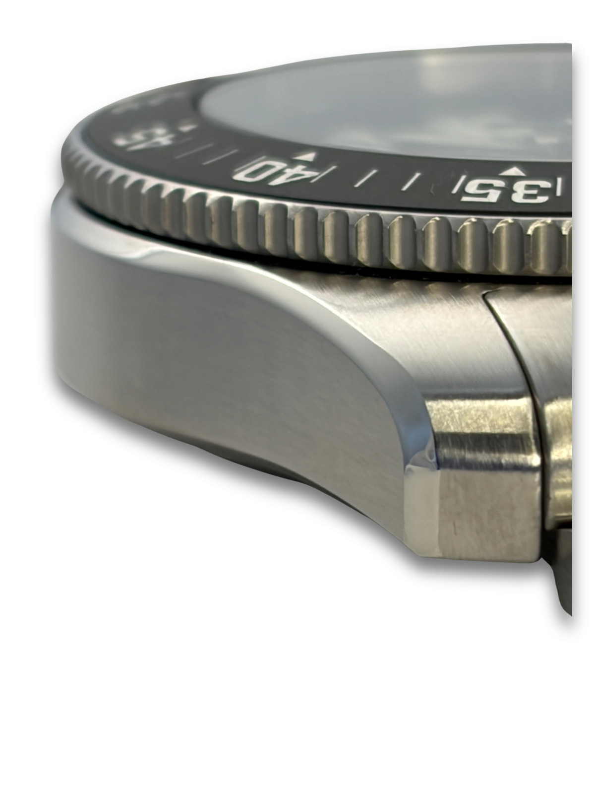 Stainless steel watch bezel with ridged minute track and blue dial window