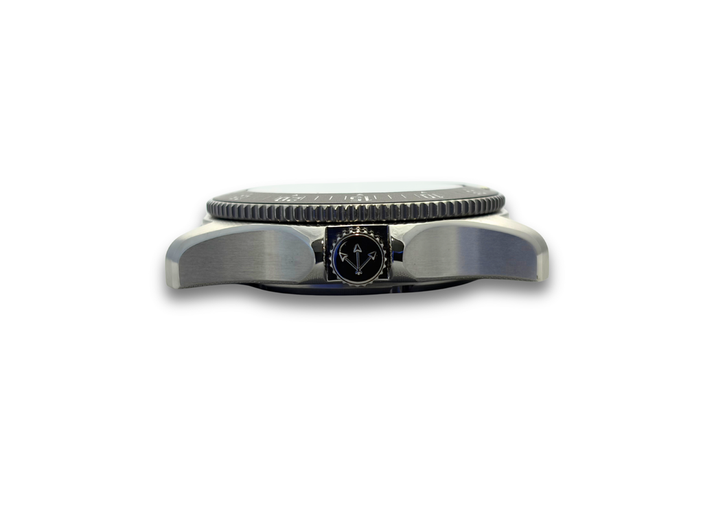 Rugged stainless steel watch bezel with dark dial and small logo panel